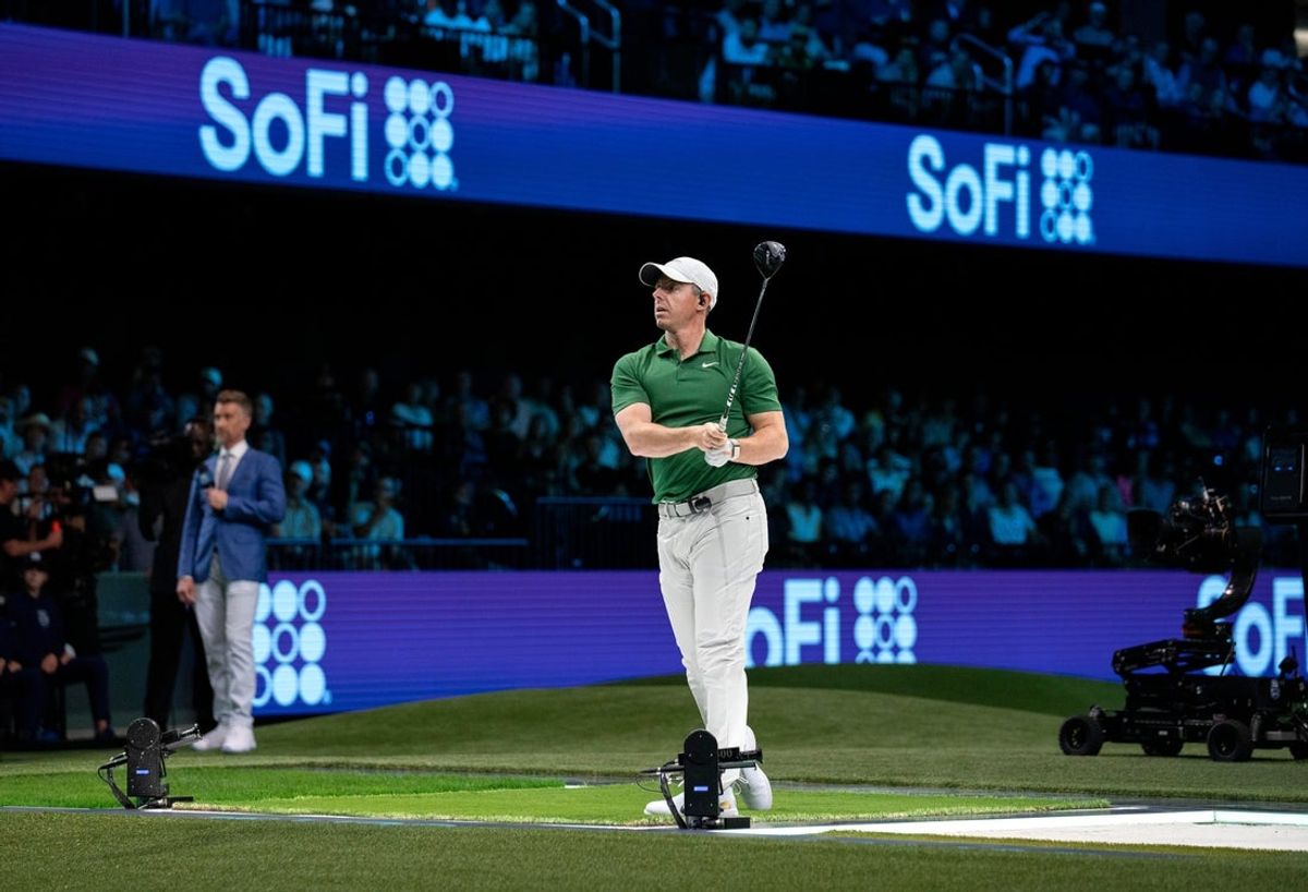 Rory McIlroy of Boston Common Golf tees off during a TGL match against Los Angeles Golf Club at the SoFi Center on February 4, 2025, in Palm Beach Gardens, Florida.