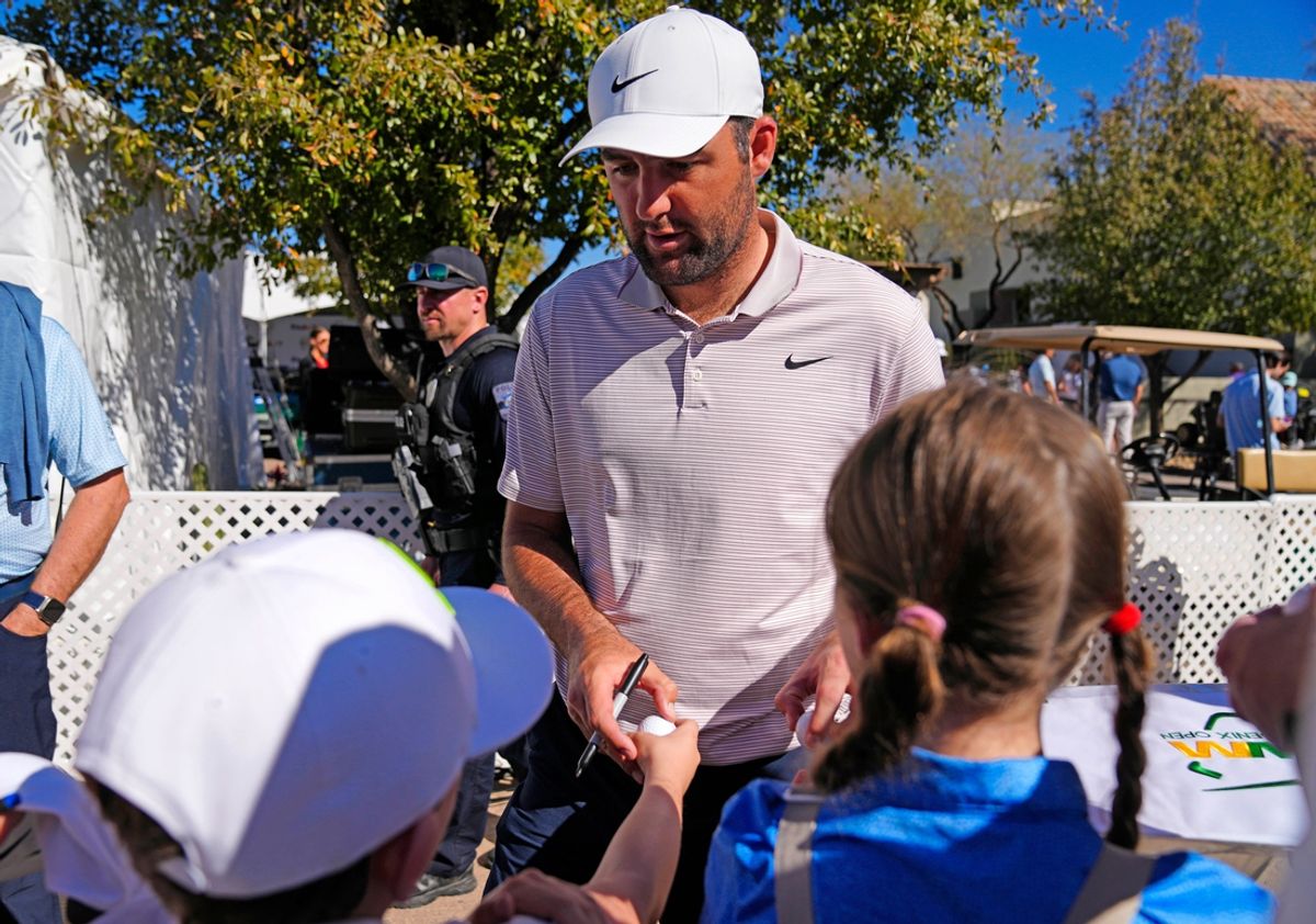 PGA golfer Scottie Scheffler signs autographs for young fans during the Phoenix Open Annexus Pro-Am at TPC Scottsdale on Feb. 5, 2025.