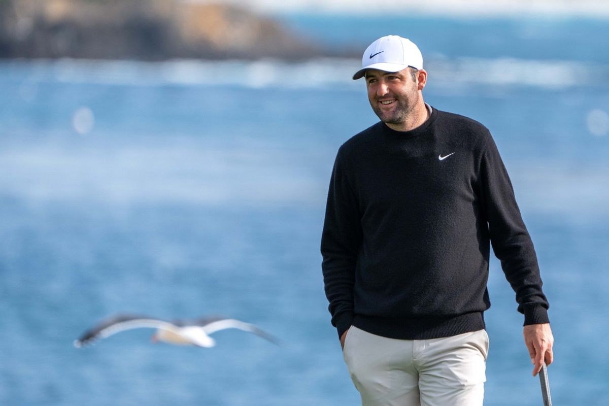 February 2, 2025; Pebble Beach, California, USA; Scottie Scheffler smiles on the 18th hole during the final round of the AT&T Pebble Beach Pro-Am golf tournament at Pebble Beach Golf Links. Mandatory Credit: Kyle Terada-Imagn Images