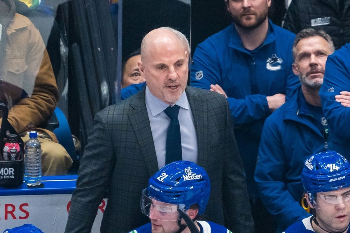 Feb 4, 2025; Vancouver, British Columbia, CAN; Vancouver Canucks head coach Rick Tocchet on the bench against the Colorado Avalanche in the first period at Rogers Arena. Mandatory Credit: Bob Frid-Imagn Images