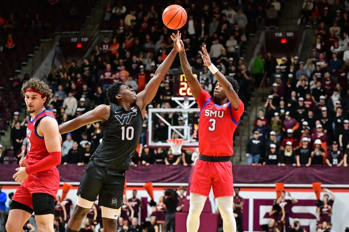 Feb 5, 2025; Blacksburg, Virginia, USA;  Southern Methodist Mustangs guard Chuck Harris (3) shoots a shot as Virginia Tech Hokies guard Tyler Johnson (10) defends in the first half at Cassell Coliseum. Mandatory Credit: Brian Bishop-Imagn Images