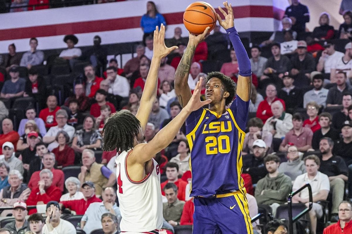 Feb 5, 2025; Athens, Georgia, USA; LSU Tigers forward Derek Fountain (20) shoots over Georgia Bulldogs forward Asa Newell (14) during the first half at Stegeman Coliseum. Mandatory Credit: Dale Zanine-Imagn Images