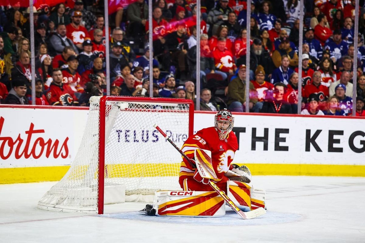 Feb 4, 2025; Calgary, Alberta, CAN; Calgary Flames goaltender Dustin Wolf (32) guards his net against the Toronto Maple Leafs during the third period at Scotiabank Saddledome. Mandatory Credit: Sergei Belski-Imagn Images