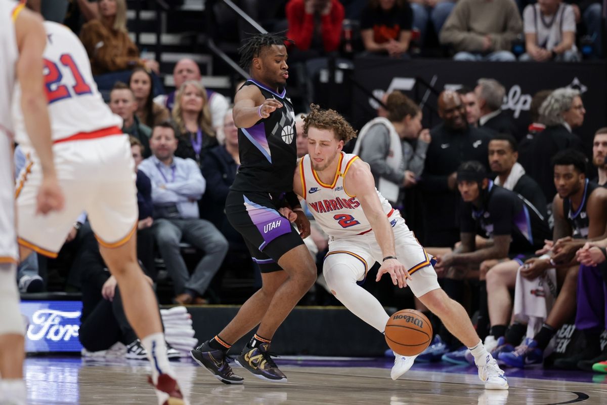 Feb 5, 2025; Salt Lake City, Utah, USA;  Golden State Warriors guard Brandin Podziemski (2) tries to get past Utah Jazz guard Isaiah Collier (13) during the second quarter at Delta Center. Mandatory Credit: Chris Nicoll-Imagn Images