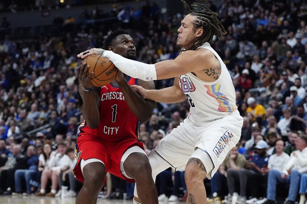 Feb 5, 2025; Denver, Colorado, USA; Denver Nuggets forward Aaron Gordon (32) defends on New Orleans Pelicans forward Zion Williamson (1) n the first half at Ball Arena. Mandatory Credit: Ron Chenoy-Imagn Images