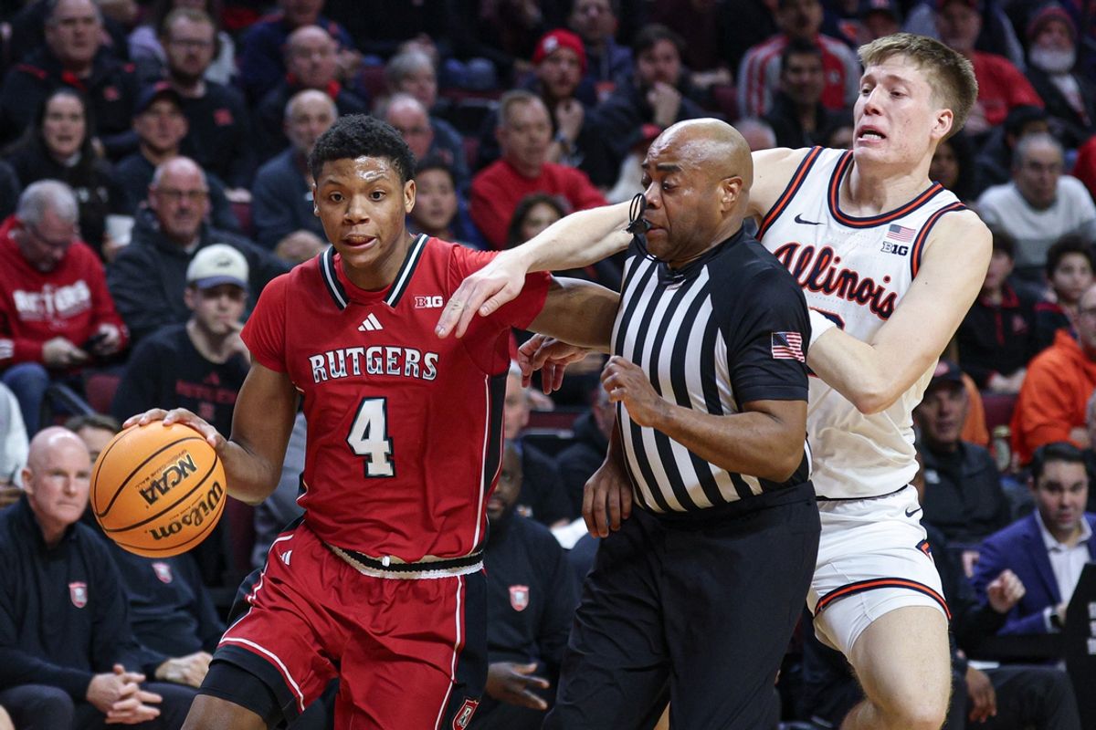 Feb 5, 2025; Piscataway, New Jersey, USA; Rutgers Scarlet Knights guard Ace Bailey (4) goes to the basket in front of Illinois Fighting Illini forward Ben Humrichous (3) and a referee during the second half at Jersey Mike's Arena. Mandatory Credit: Vincent Carchietta-Imagn Images