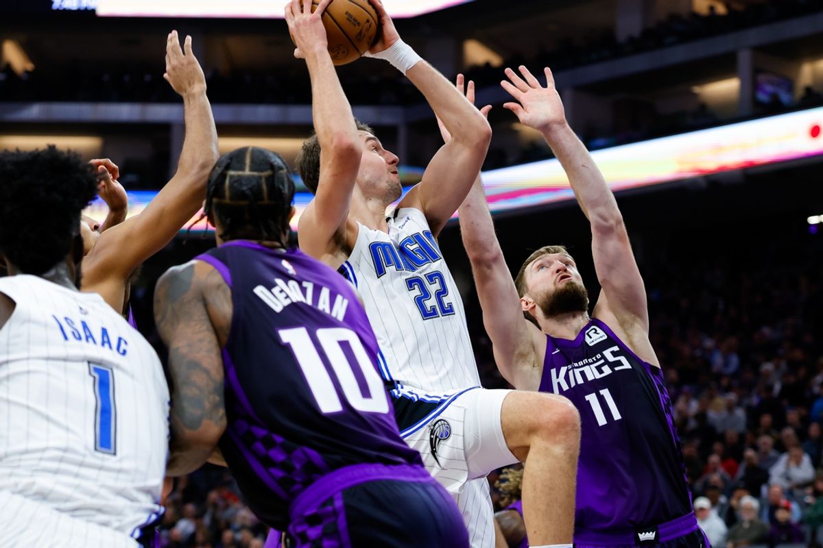 Feb 5, 2025; Sacramento, California, USA; Orlando Magic forward Franz Wagner (22) shoots the ball against Sacramento Kings forward Domantas Sabonis (11) during the second quarter at Golden 1 Center. Mandatory Credit: Sergio Estrada-Imagn Images
