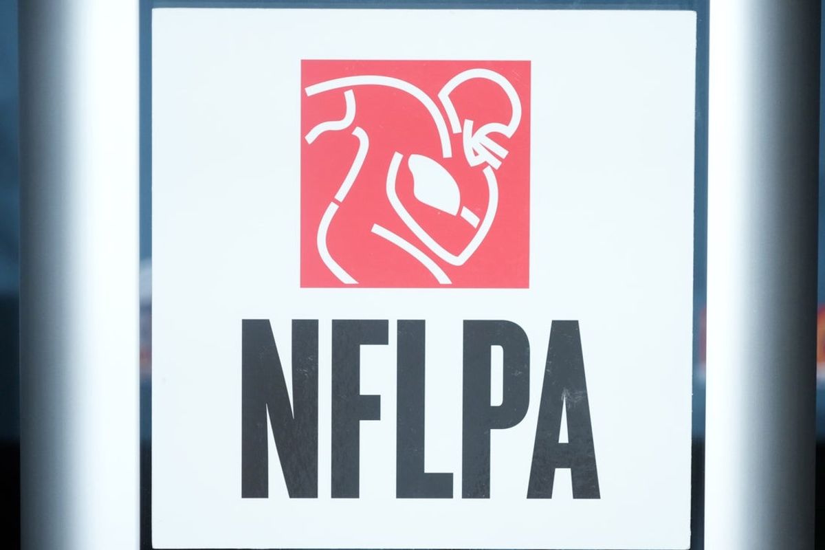 Feb 5, 2025; New Orleans, LA, USA; The NFLPA logo at press conference at the Super Bowl LIX media center at the  Ernest N. Morial Convention Center. Mandatory Credit: Kirby Lee-Imagn Images
