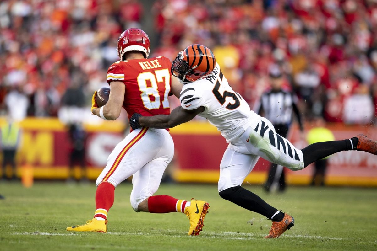Cincinnati Bengals linebacker Germaine Pratt (57) tackles Kansas City Chiefs tight end Travis Kelce (87) in the fourth quarter of the AFC championship game on Jan. 30, 2022, at GEHA Field at Arrowhead Stadium in Kansas City, Mo.