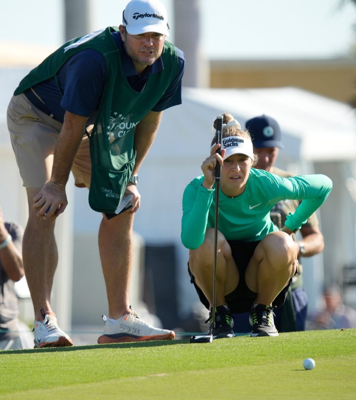 Nelly Korda of Bradenton, Florida, and her caddie, Jason McDede, look at her putt on the fourth hole on Thursday, Feb. 6, during the first round of the LPGA 2025 Founders Cup at the Bradenton Country Club in Bradenton, Florida.