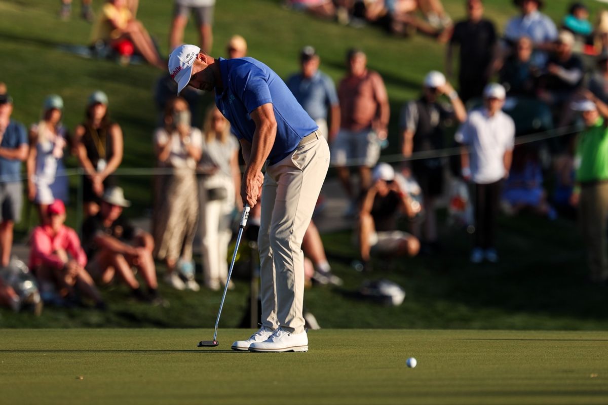 Feb 6, 2025; Scottsdale, Arizona, USA; Wyndham Clark of the United States putts on the 18th hole during the first round of the WM Phoenix Open golf tournament. Mandatory Credit: Aryanna Frank-Imagn Images