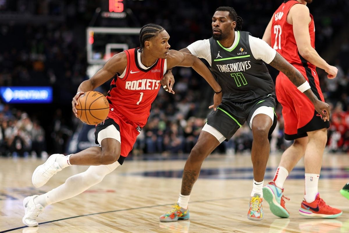 Feb 6, 2025; Minneapolis, Minnesota, USA; Houston Rockets forward Amen Thompson (1) works around Minnesota Timberwolves center Naz Reid (11) during the first quarter at Target Center. Mandatory Credit: Matt Krohn-Imagn Images