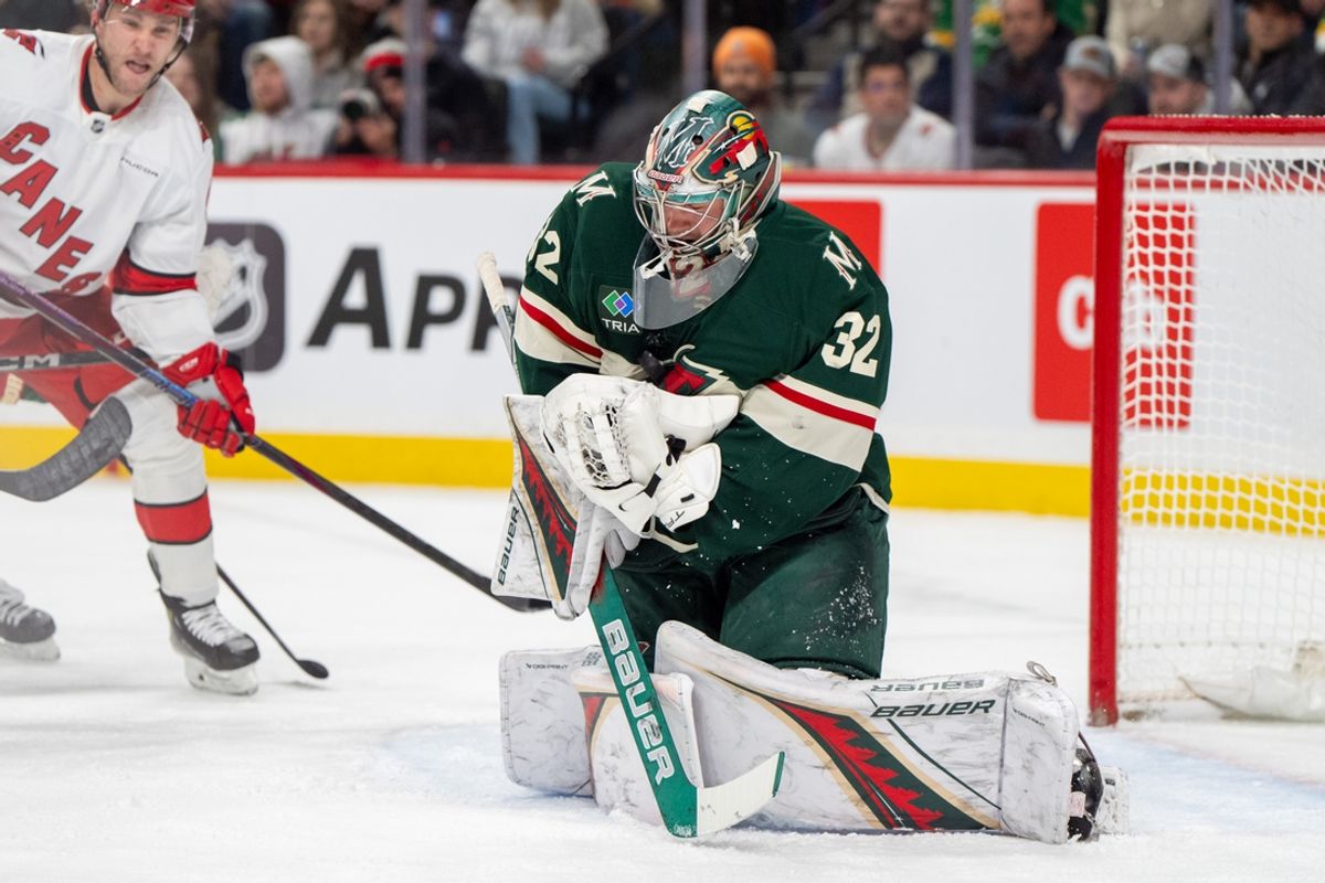 Feb 6, 2025; Saint Paul, Minnesota, USA; Minnesota Wild goaltender Filip Gustavsson (32) makes a save against the Carolina Hurricanes in the first period at Xcel Energy Center. Mandatory Credit: Matt Blewett-Imagn Images