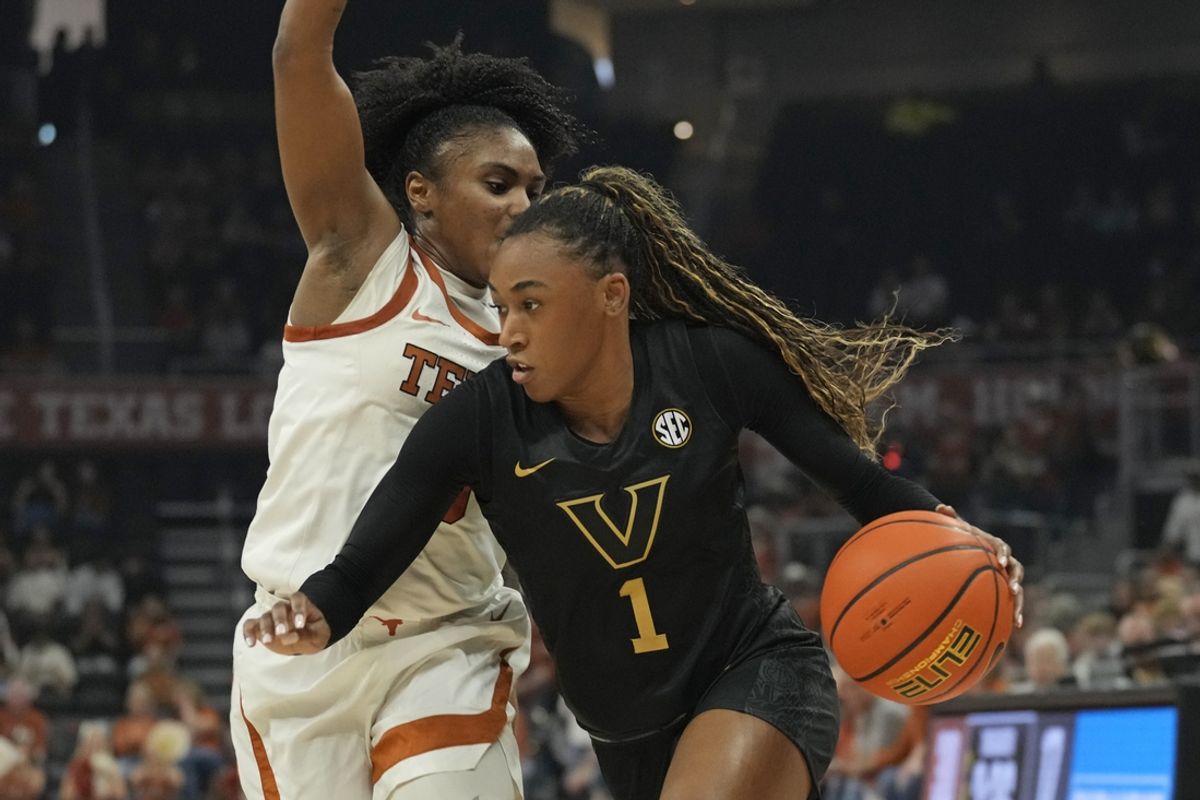 Feb 6, 2025; Austin, Texas, USA; Vanderbilt Commodores guard Mikayla Blakes (1) drives to the basket against Texas Longhorns guard Rori Harmon (3) during the first half at Moody Center. Mandatory Credit: Scott Wachter-Imagn Images