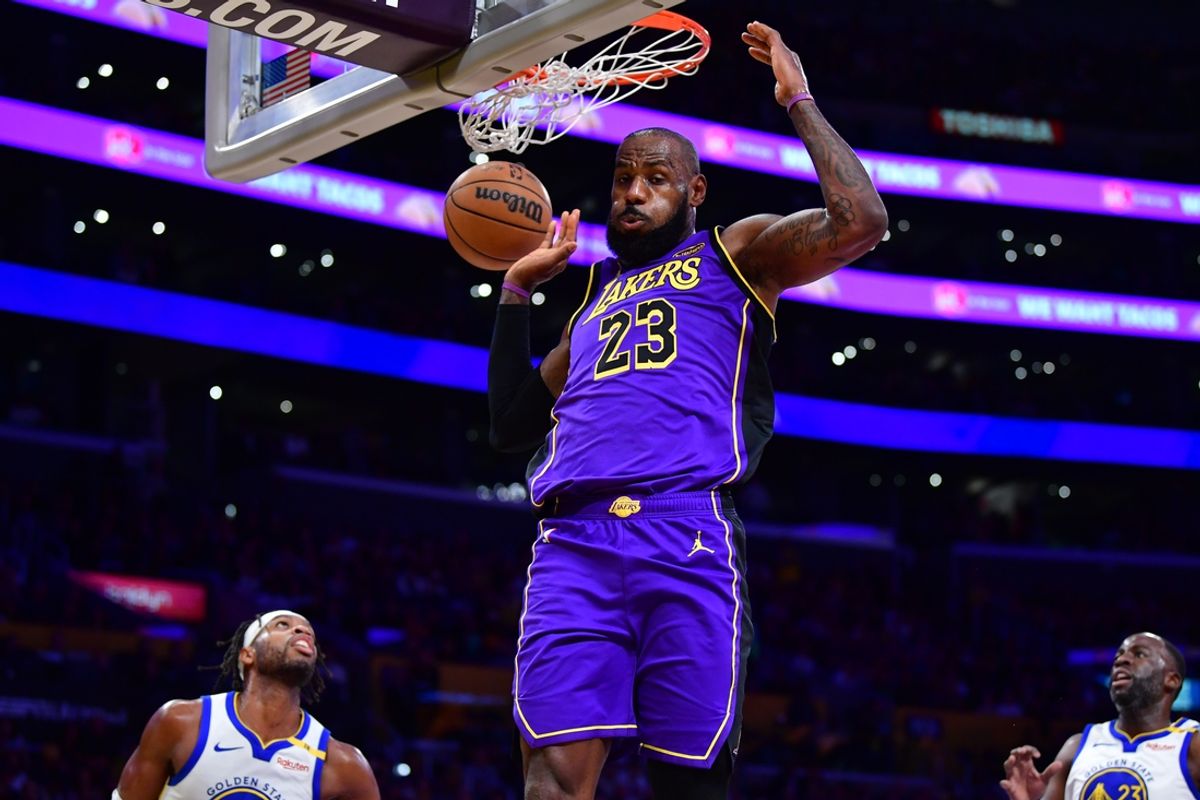 Feb 6, 2025; Los Angeles, California, USA;  Los Angeles Lakers forward LeBron James (23) dunks for the basket against the against the Golden State Warriors during the first half at Crypto.com Arena. Mandatory Credit: Gary A. Vasquez-Imagn Images