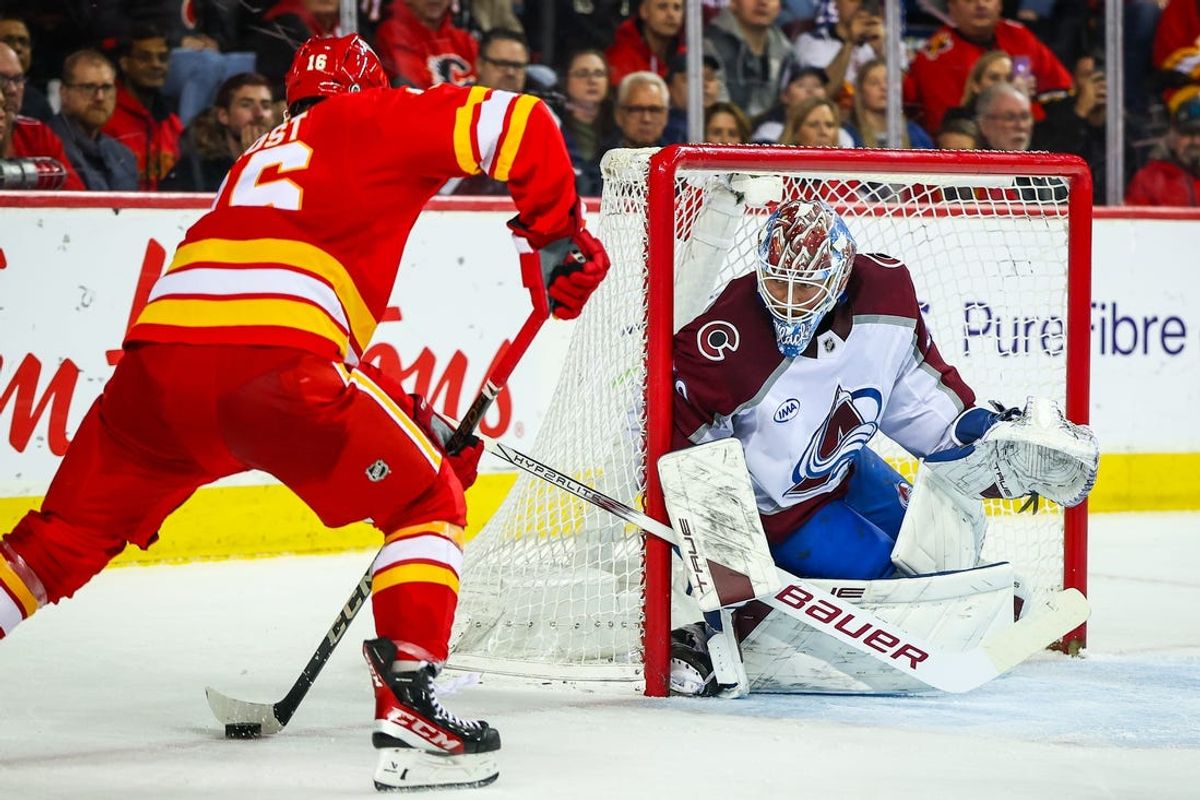 Feb 6, 2025; Calgary, Alberta, CAN; Colorado Avalanche goaltender Mackenzie Blackwood (39) guards his net against Calgary Flames center Morgan Frost (16) during the second period at Scotiabank Saddledome. Mandatory Credit: Sergei Belski-Imagn Images