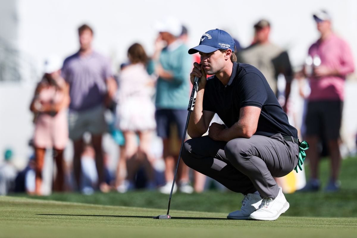 Feb 7, 2025; Scottsdale, Arizona, USA; Thomas Detry of Belgium evaluates where his ball landed before he putts at the 18th hole during the second round of the WM Phoenix Open golf tournament. Mandatory Credit: Aryanna Frank-Imagn Images