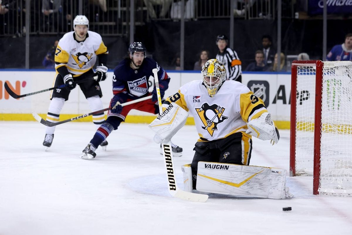Feb 7, 2025; New York, New York, USA; Pittsburgh Penguins goaltender Alex Nedeljkovic (39) plays the puck against the New York Rangers during the second period at Madison Square Garden. Mandatory Credit: Brad Penner-Imagn Images