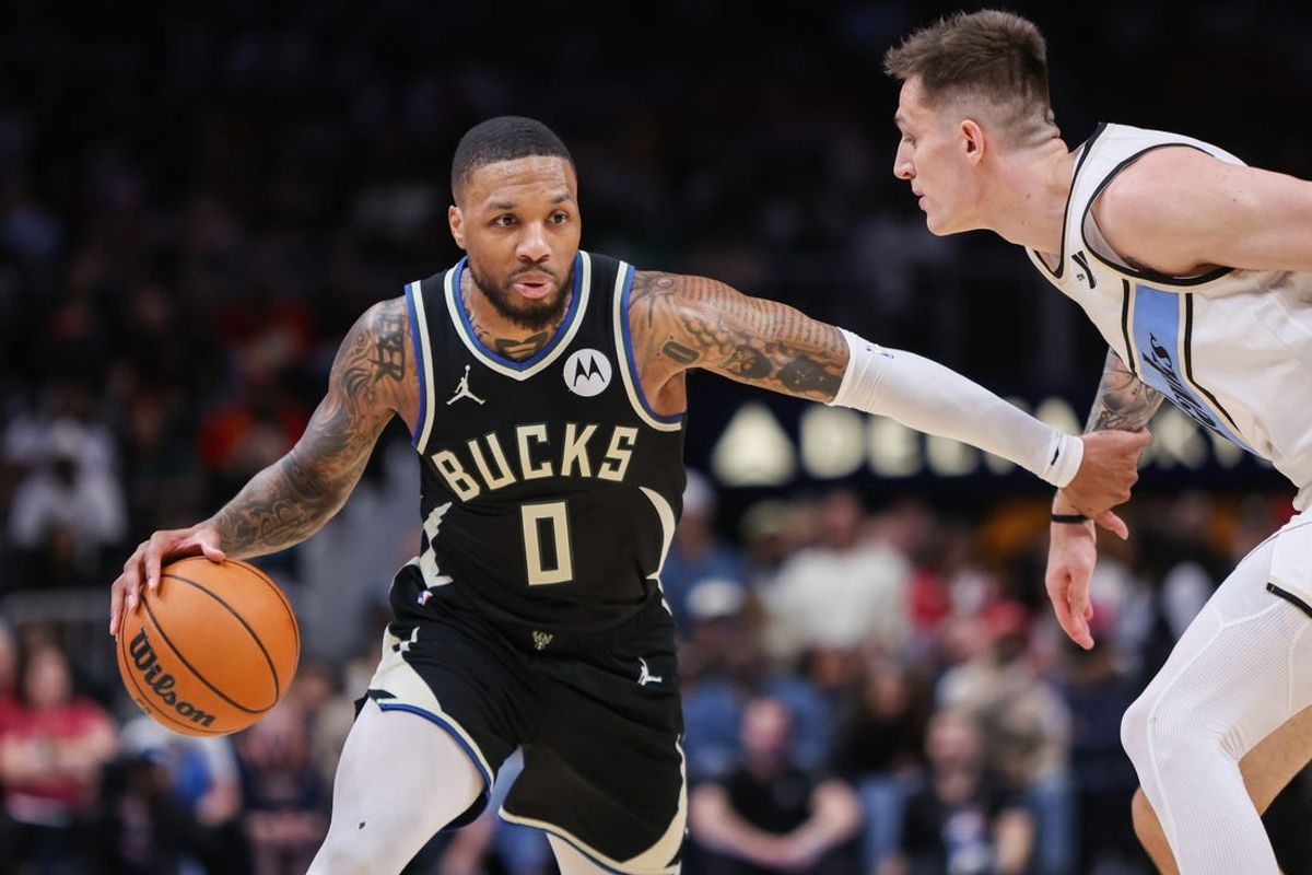 Feb 7, 2025; Atlanta, Georgia, USA; Milwaukee Bucks guard Damian Lillard (0) is defended by Atlanta Hawks guard Vit Krejci (27) in the second quarter at State Farm Arena. Mandatory Credit: Brett Davis-Imagn Images