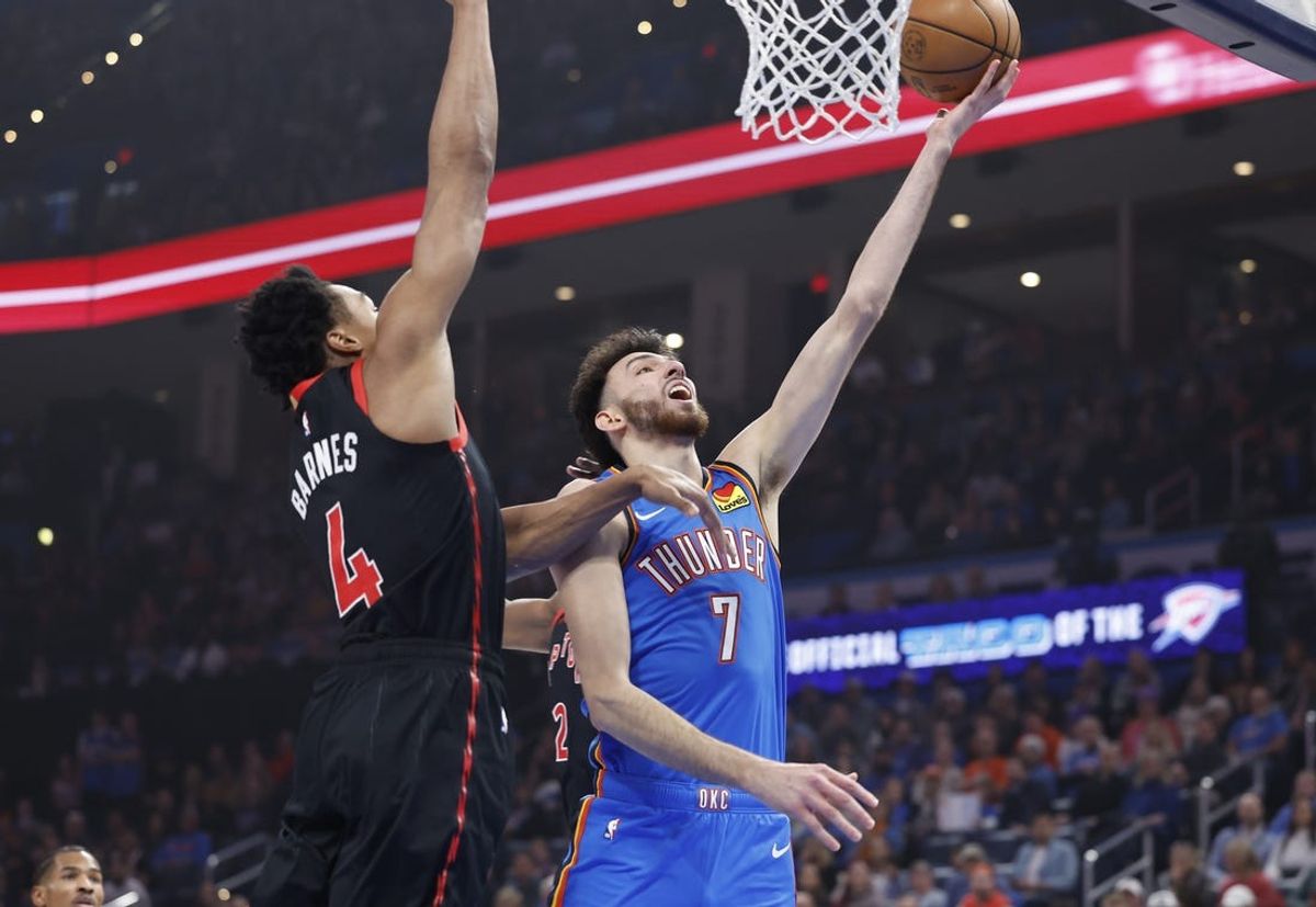 Feb 7, 2025; Oklahoma City, Oklahoma, USA; Oklahoma City Thunder forward Chet Holmgren (7) shoots beside Toronto Raptors forward Scottie Barnes (4) during the first quarter at Paycom Center. Mandatory Credit: Alonzo Adams-Imagn Images