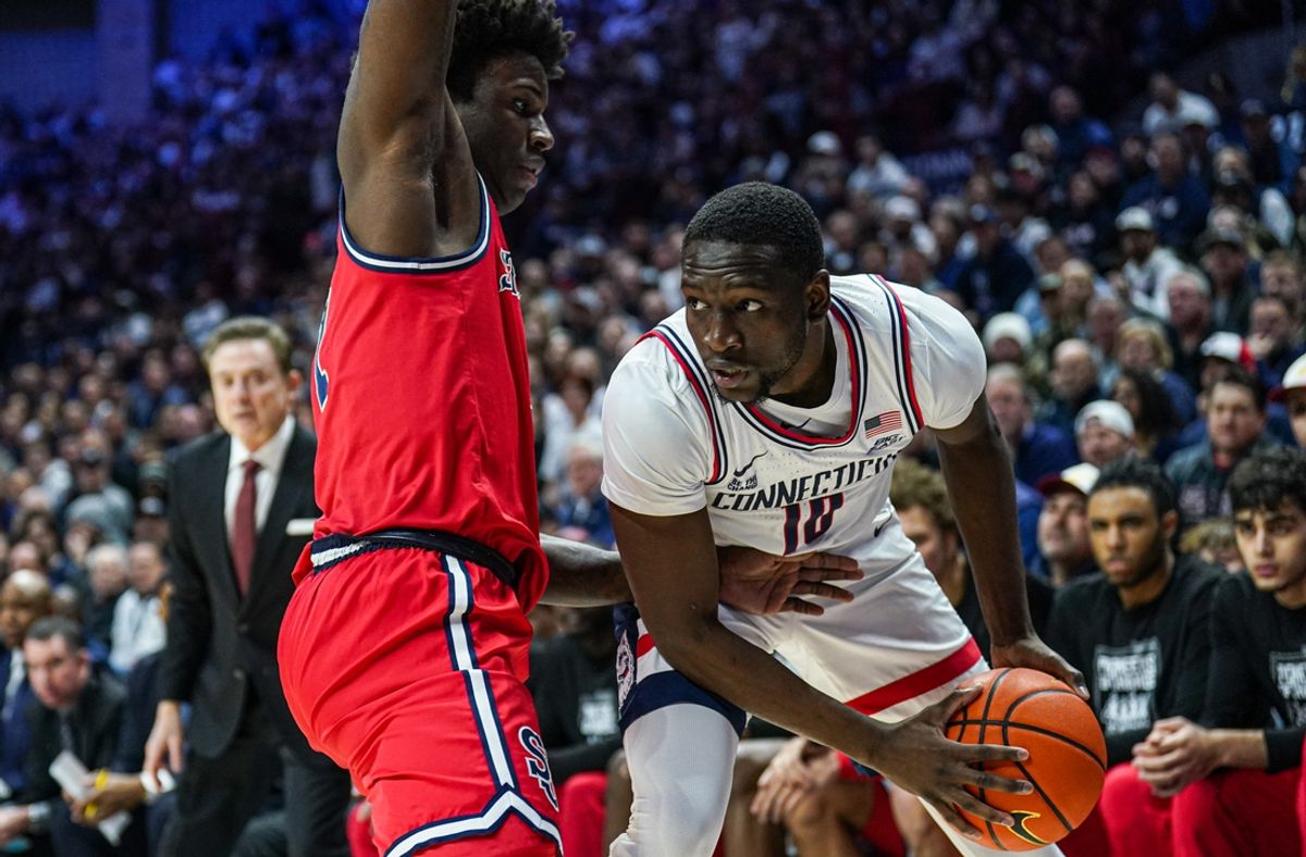 Feb 7, 2025; Storrs, Connecticut, USA; UConn Huskies guard Hassan Diarra (10) looks for an opening against St. John's Red Storm guard Kadary Richmond (1) in the first half at Harry A. Gampel Pavilion. Mandatory Credit: David Butler II-Imagn Images