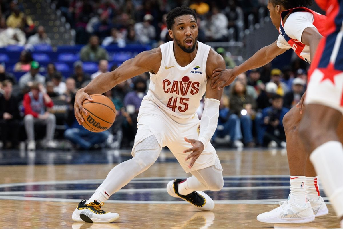 Feb 7, 2025; Washington, District of Columbia, USA; Cleveland Cavaliers guard Donovan Mitchell (45) hands the ball during the third quarter against the Washington Wizards at Capital One Arena. Mandatory Credit: Reggie Hildred-Imagn Images