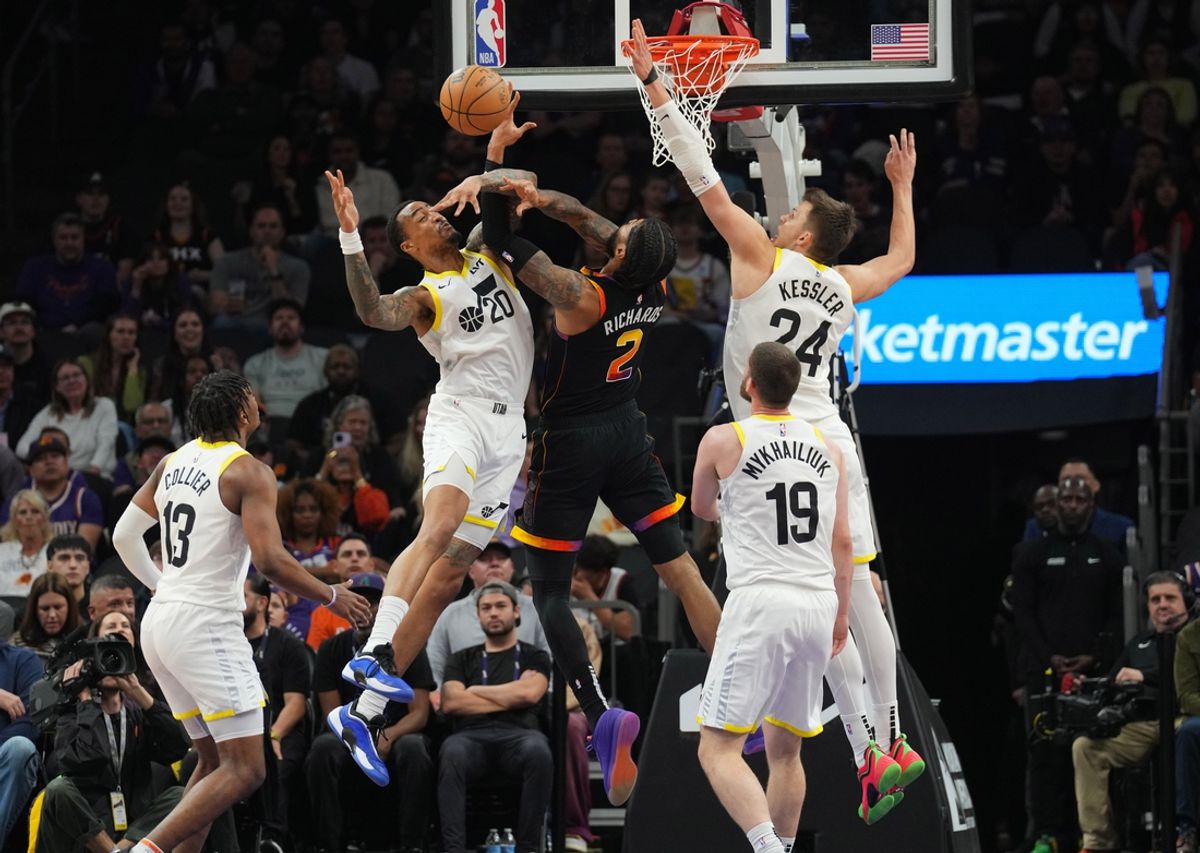 Feb 7, 2025; Phoenix, Arizona, USA; Utah Jazz forward John Collins (20) and Utah Jazz center Walker Kessler (24) defend Phoenix Suns center Nick Richards (2) during the first half at Footprint Center. Mandatory Credit: Joe Camporeale-Imagn Images