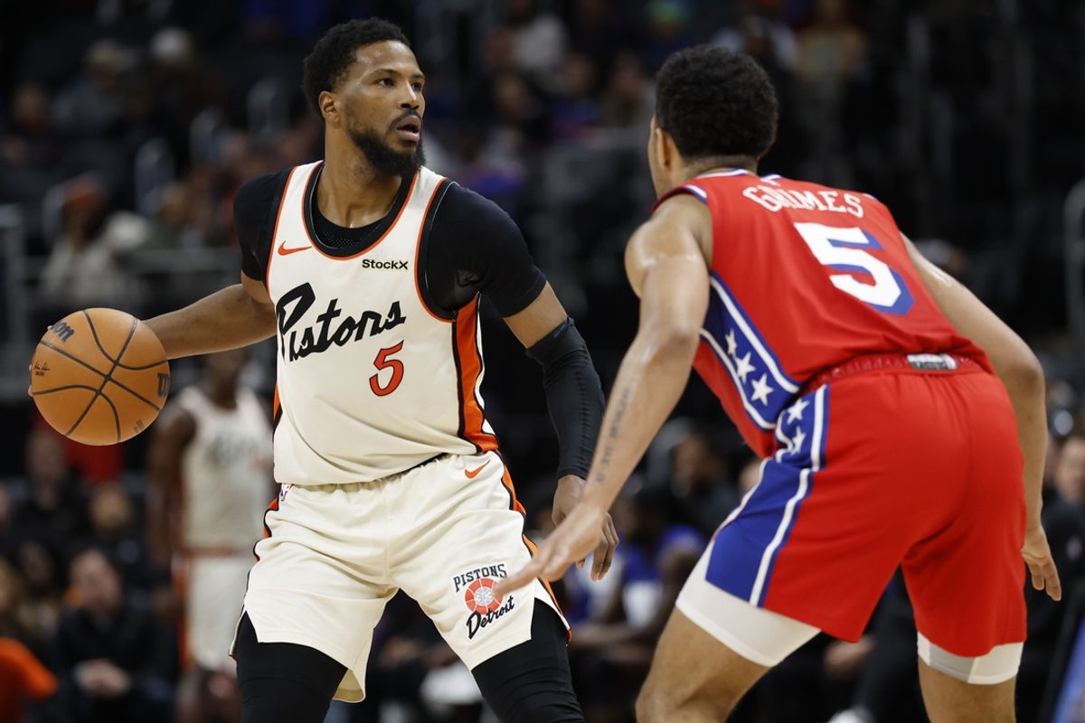 Feb 7, 2025; Detroit, Michigan, USA;  Detroit Pistons guard Malik Beasley (5) dribbles defended by Philadelphia 76ers guard Quentin Grimes (5) in the second half at Little Caesars Arena. Mandatory Credit: Rick Osentoski-Imagn Images