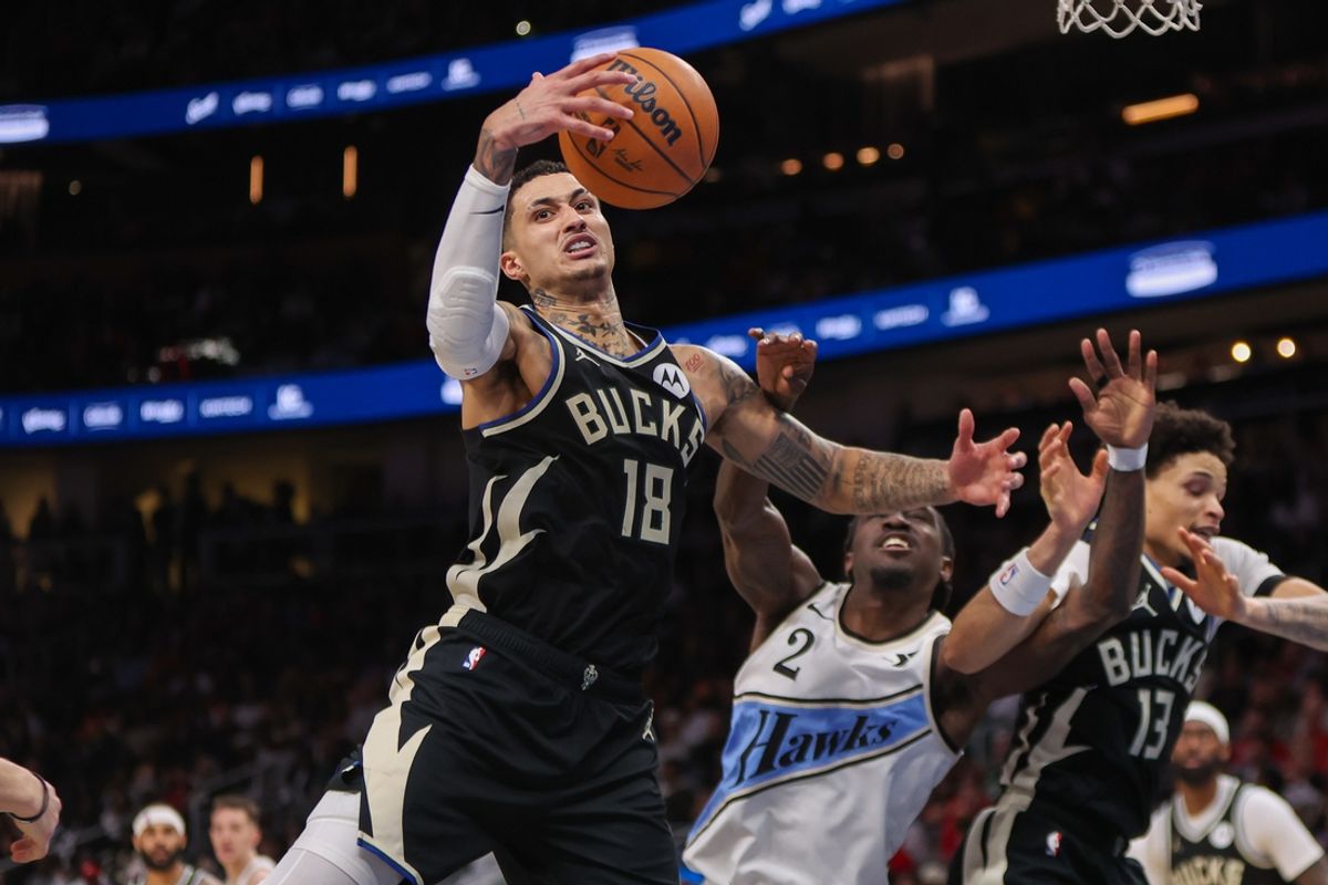 Feb 7, 2025; Atlanta, Georgia, USA; Milwaukee Bucks forward Kyle Kuzma (18) grabs a rebound against the Atlanta Hawks in the fourth quarter at State Farm Arena. Mandatory Credit: Brett Davis-Imagn Images