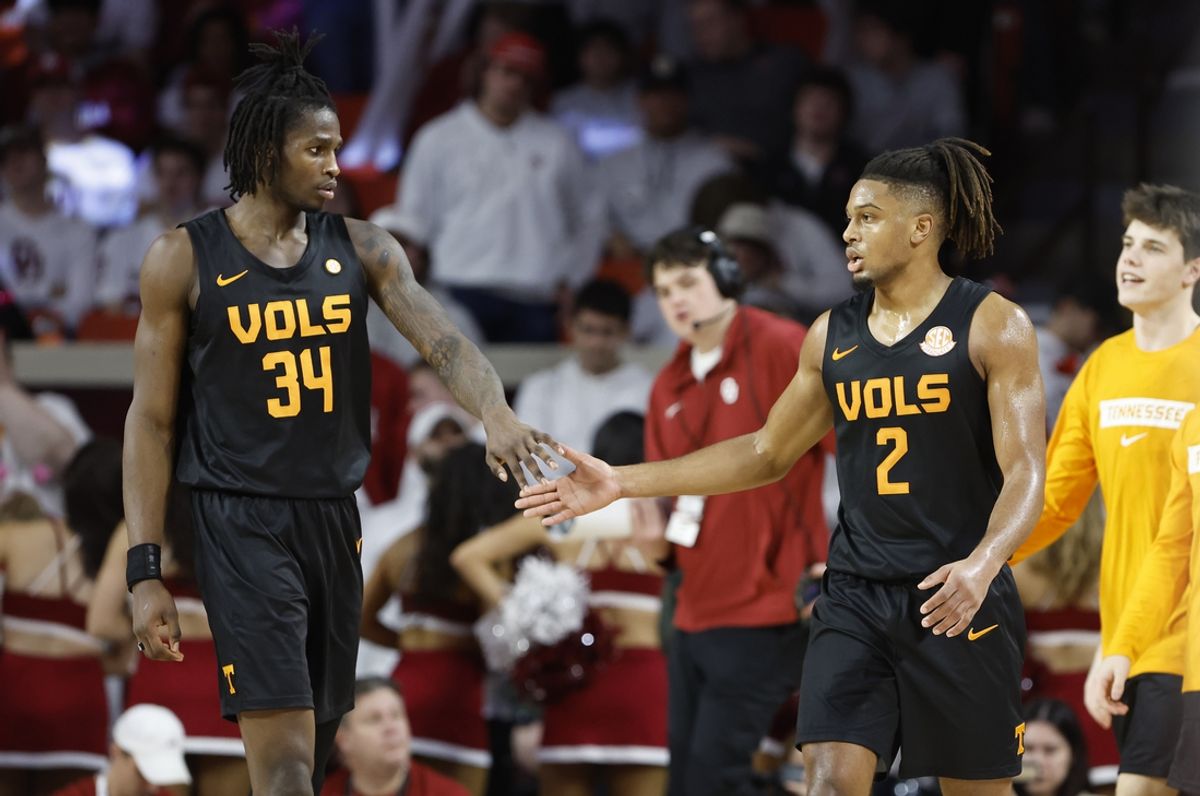 Feb 8, 2025; Norman, Oklahoma, USA; Tennessee Volunteers forward Felix Okpara (34) and Tennessee Volunteers guard Chaz Lanier (2) high five during the first half against the Oklahoma Sooners at Lloyd Noble Center. Mandatory Credit: Alonzo Adams-Imagn Images