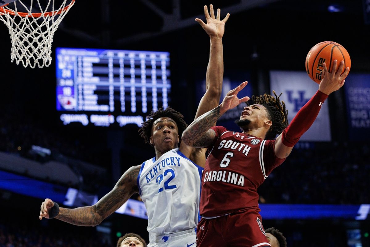 Feb 8, 2025; Lexington, Kentucky, USA; South Carolina Gamecocks guard Jamarii Thomas (6) goes to the basket against Kentucky Wildcats center Amari Williams (22) during the first half at Rupp Arena at Central Bank Center. Mandatory Credit: Jordan Prather-Imagn Images