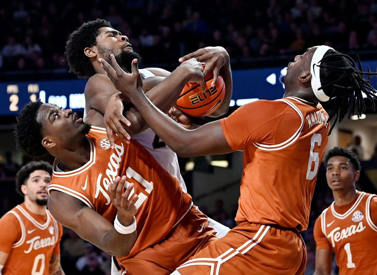 Vanderbilt forward Jaylen Carey (22) pulls in a rebound against Texas’ Ze'Rik Onyema (21) and Arthur Kaluma (6) during an NCAA college basketball game Saturday, Jan. 8, 2025, in Nashville, Tenn.