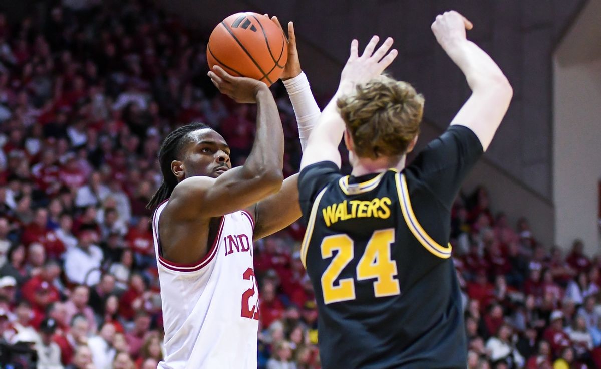 Feb 8, 2025; Bloomington, Indiana, USA; Indiana Hoosiers forward Mackenzie Mgbako (21) shoots over Michigan Wolverines forward Sam Walters (24) during the first half at Simon Skjodt Assembly Hall. Mandatory Credit: Robert Goddin-Imagn Images