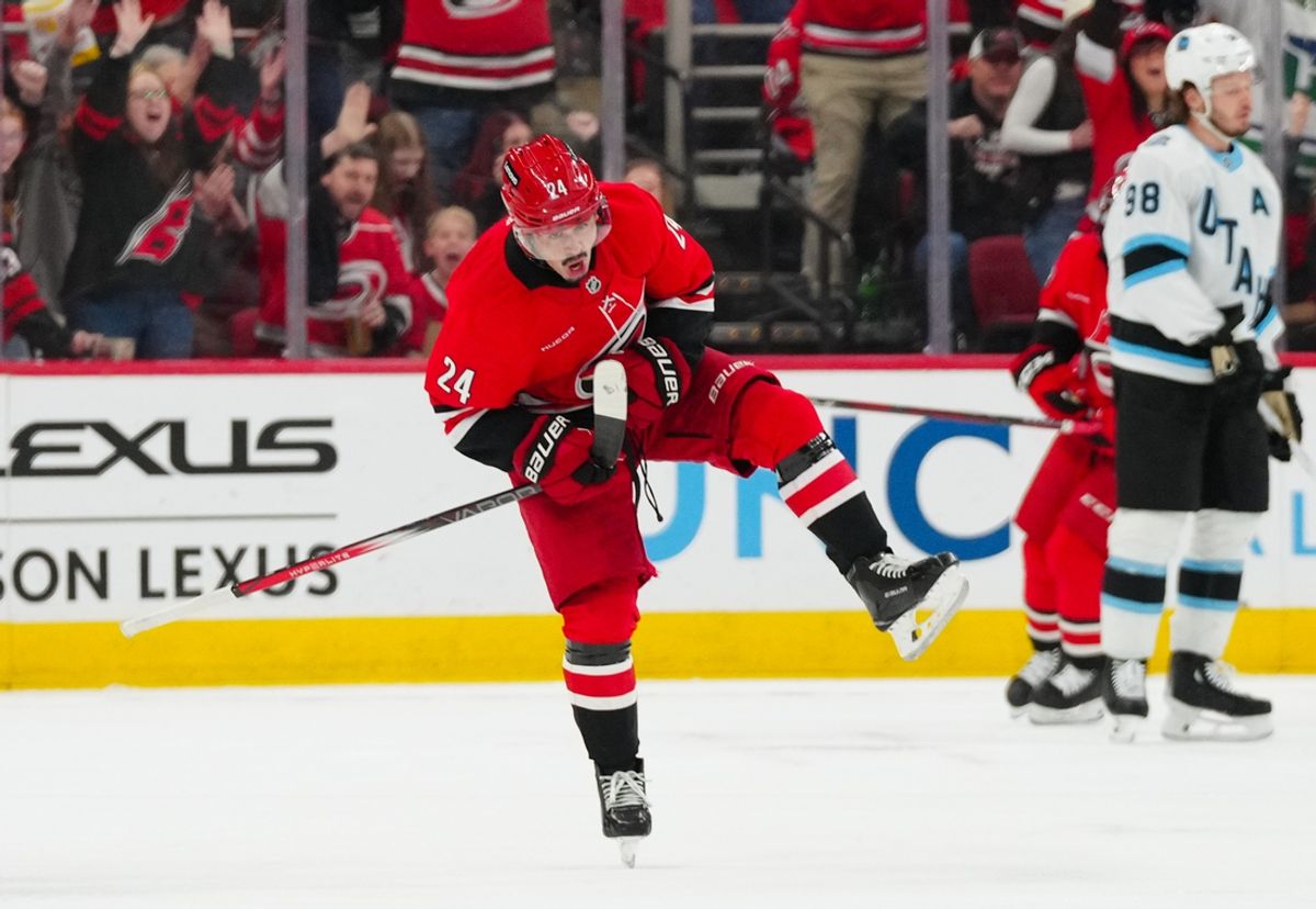 Feb 8, 2025; Raleigh, North Carolina, USA;  Carolina Hurricanes center Seth Jarvis (24) celebrates his goal against the Utah Hockey Club during the second period at Lenovo Center. Mandatory Credit: James Guillory-Imagn Images