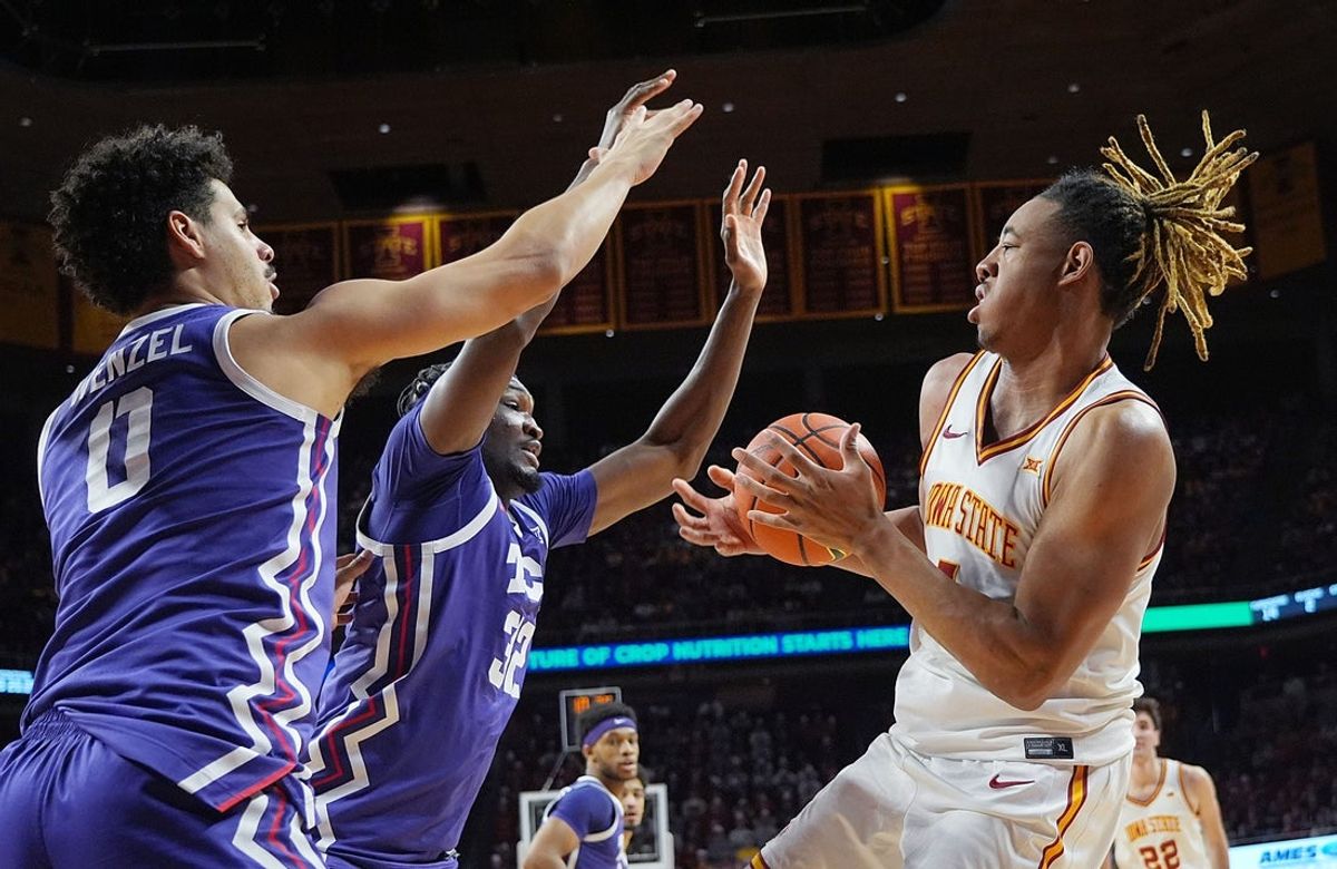 Iowa State Cyclones center Dishon Jackson (1) looks for drive to the basket around TCU Horned Frogs Guard Brendan Wenzel (0) and center Malick Diallo (32) during the second half in the Big-12 men’s basketball at Hilton Coliseum on Feb 8, 2025 in Ames, Iowa.