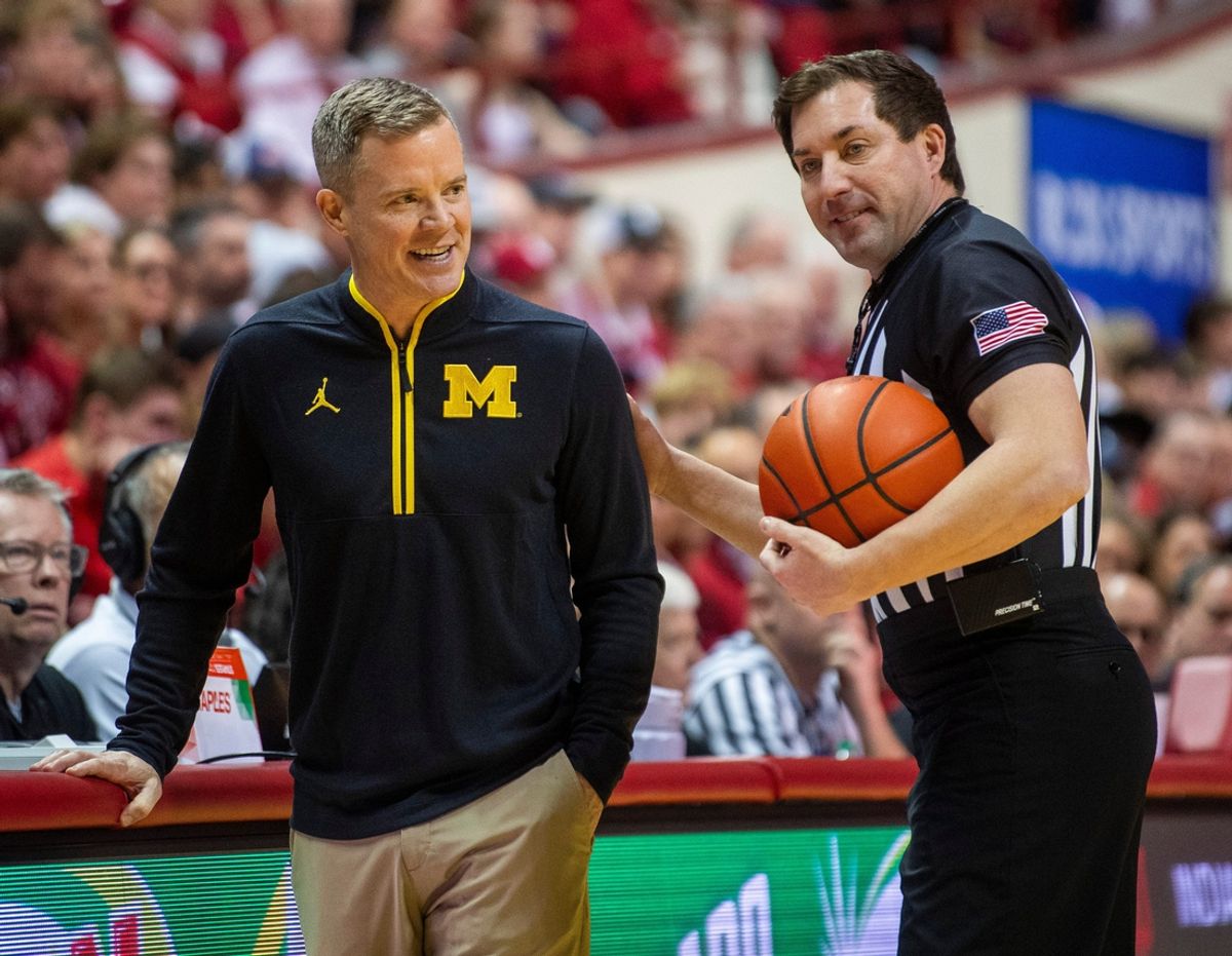 Michigan coach Dusty May talks with an official during the Indiana vs. Michigan game at Simon Skjodt Assembly Hall on Saturday, Feb. 8, 2025 in Bloomington, Indiana.