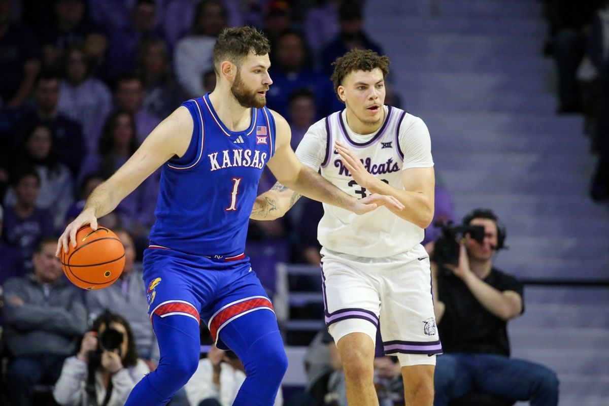 Feb 8, 2025; Manhattan, Kansas, USA; Kansas Jayhawks center Hunter Dickinson (1) is guarded by Kansas State Wildcats forward Coleman Hawkins (33) during the first half  at Bramlage Coliseum. Mandatory Credit: Scott Sewell-Imagn Images