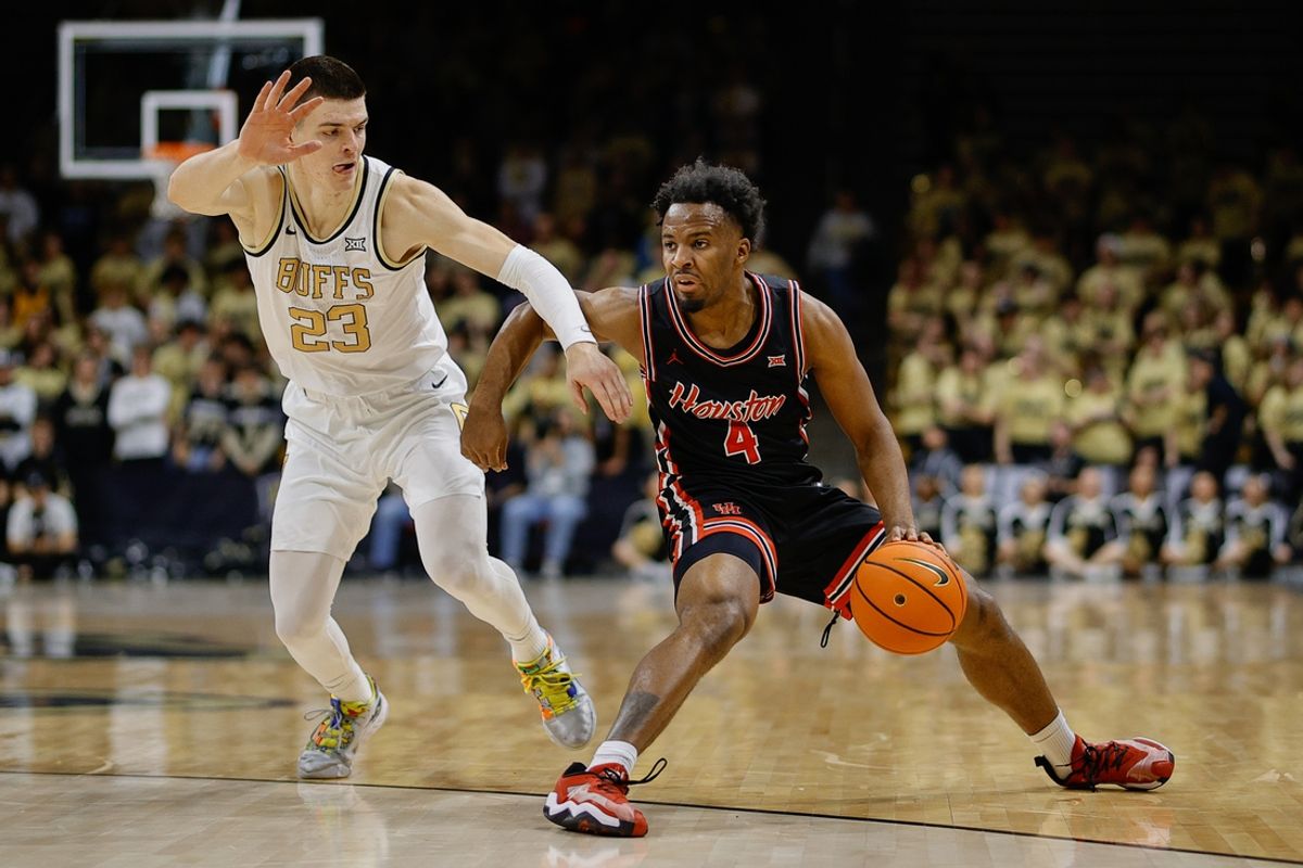 Feb 8, 2025; Boulder, Colorado, USA; Houston Cougars guard L.J. Cryer (4) controls the ball as Colorado Buffaloes forward Andrej Jakimovski (23) guards in the first half at CU Events Center. Mandatory Credit: Isaiah J. Downing-Imagn Images