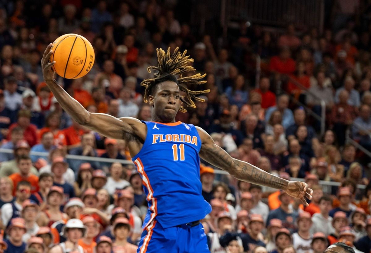 Florida Gators guard Denzel Aberdeen (11) grabs a pass as Auburn Tigers take on Florida Gators at Neville Arena in Auburn, Ala., on Saturday, Feb. 8, 2025. Florida Gators lead Auburn Tigers 48-38 at halftime.