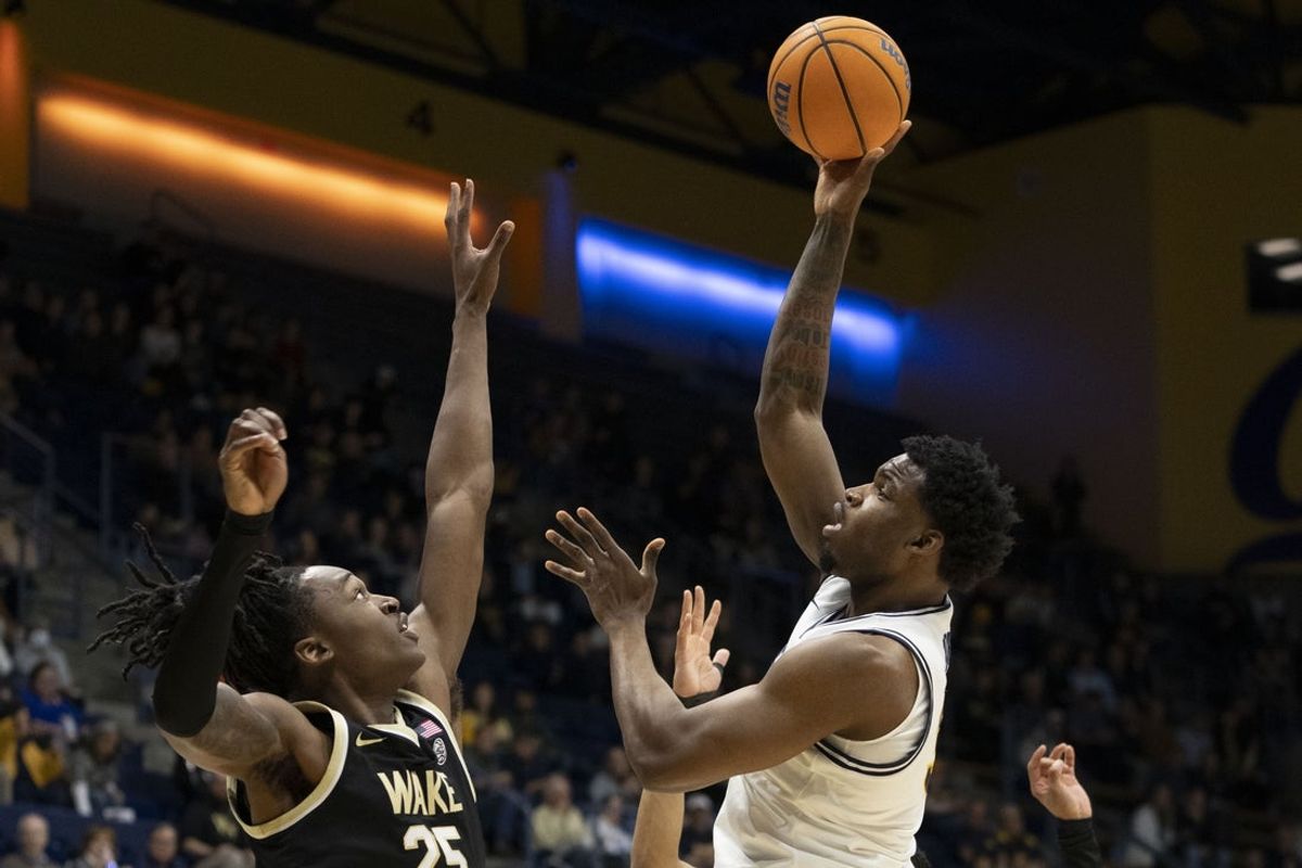 February 8, 2025; Berkeley, California, USA; California Golden Bears forward Lee Dort (34) shoots the basketball against Wake Forest Demon Deacons forward Tre'Von Spillers (25) during the first half at Haas Pavilion. Mandatory Credit: Kyle Terada-Imagn Images