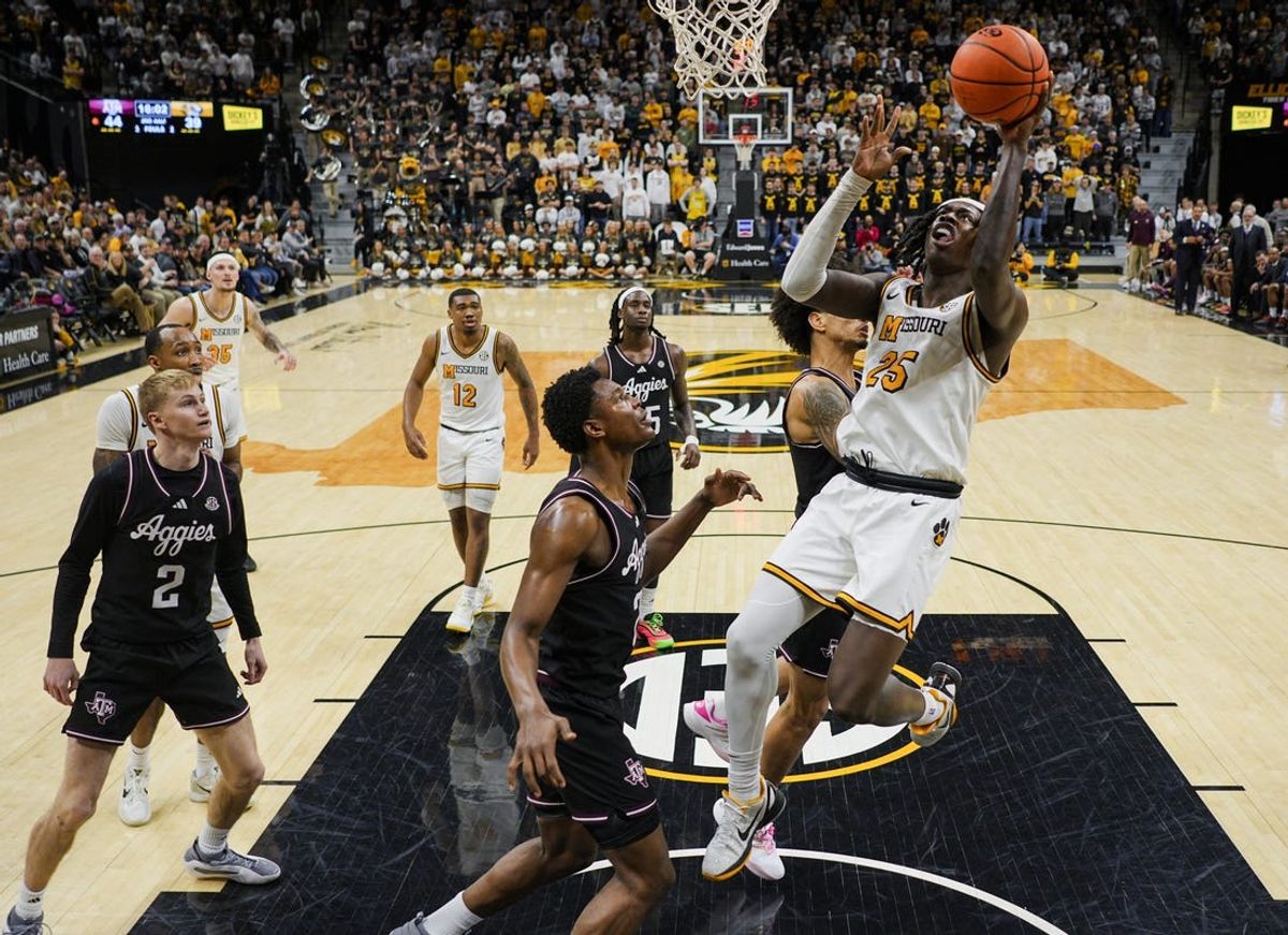 Feb 8, 2025; Columbia, Missouri, USA; Missouri Tigers guard Mark Mitchell (25) shoots against the Texas A&M Aggies during the second half at Mizzou Arena. Mandatory Credit: Jay Biggerstaff-Imagn Images