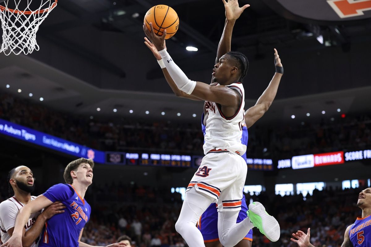 Feb 8, 2025; Auburn, Alabama, USA;  Auburn Tigers guard Miles Kelly (13) takes a shot against the Florida Gators during the second half at Neville Arena. Mandatory Credit: John Reed-Imagn Images