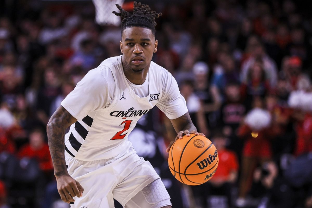 Feb 8, 2025; Cincinnati, Ohio, USA; Cincinnati Bearcats guard Jizzle James (2) dribbles against the Brigham Young Cougars in the first half at Fifth Third Arena. Mandatory Credit: Katie Stratman-Imagn Images