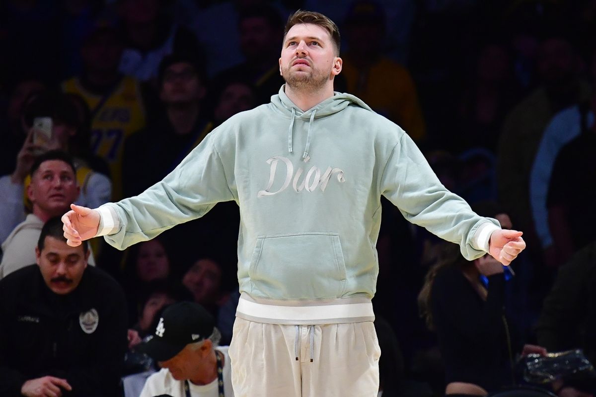 Feb 8, 2025; Los Angeles, California, USA; Los Angeles Lakers guard Luka Doncic (77) reacts watching game action against the Indiana Pacers during the second half at Crypto.com Arena. Mandatory Credit: Gary A. Vasquez-Imagn Images