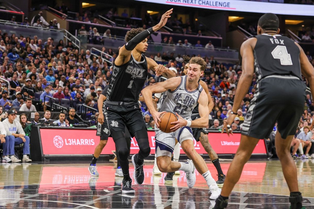 Feb 8, 2025; Orlando, Florida, USA; Orlando Magic forward Franz Wagner (22) drives to the basket against San Antonio Spurs center Victor Wembanyama (1) during the first quarter at Kia Center. Mandatory Credit: Mike Watters-Imagn Images