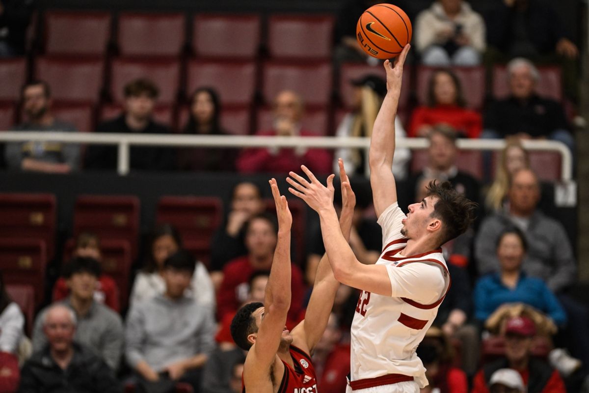 Feb 8, 2025; Stanford, California, USA; Stanford Cardinal forward Maxime Raynaud (42) shoots over NC State Wolfpack forward Ismael Diouf (33) in the first half at Maples Pavilion. Mandatory Credit: Eakin Howard-Imagn Images