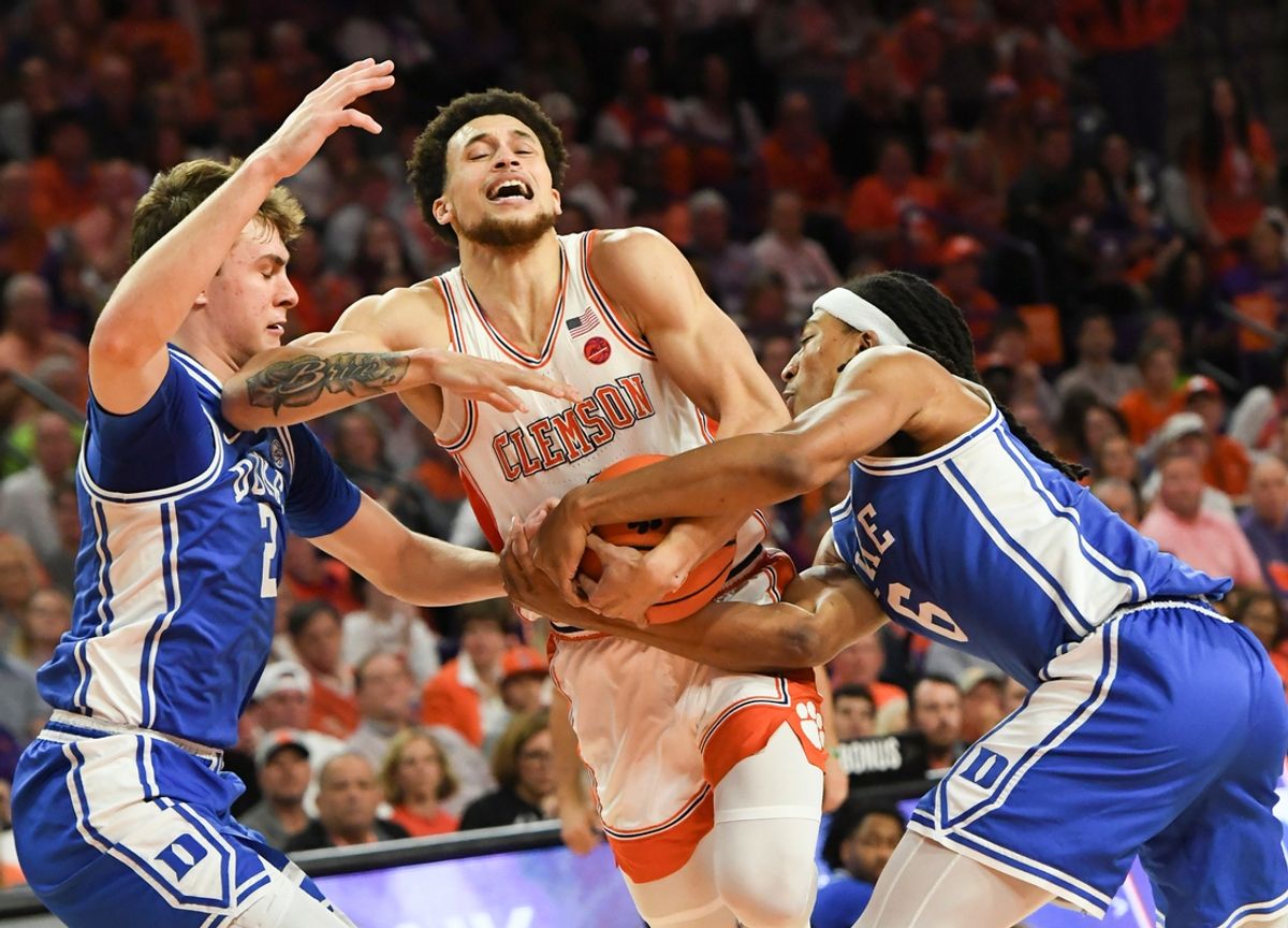 Feb 8, 2025; Clemson, South Carolina, USA; Clemson Tigers guard Chase Hunter (1) is fouled by Duke blue Devils forward Maliq Brown (6) near Duke forward Cooper Flagg (2), left, during the first half at Littlejohn Coliseum. Mandatory Credit: Ken Ruinard/USA Today Network via magn Images