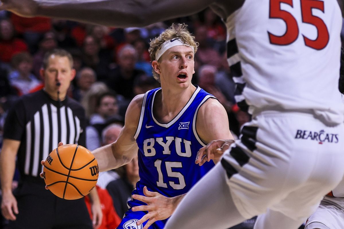 Feb 8, 2025; Cincinnati, Ohio, USA; Brigham Young Cougars forward Richie Saunders (15) dribbles against the Cincinnati Bearcats in the second half at Fifth Third Arena. Mandatory Credit: Katie Stratman-Imagn Images