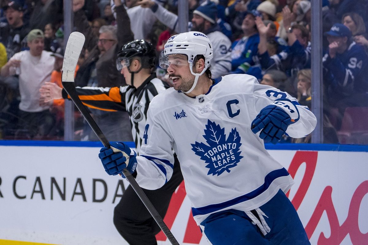Feb 8, 2025; Vancouver, British Columbia, CAN; Toronto Maple Leafs forward Auston Matthews (34) celebrates a goal scored defenseman Morgan Rielly (44) against the Vancouver Canucks in the second period at Rogers Arena. Mandatory Credit: Bob Frid-Imagn Images