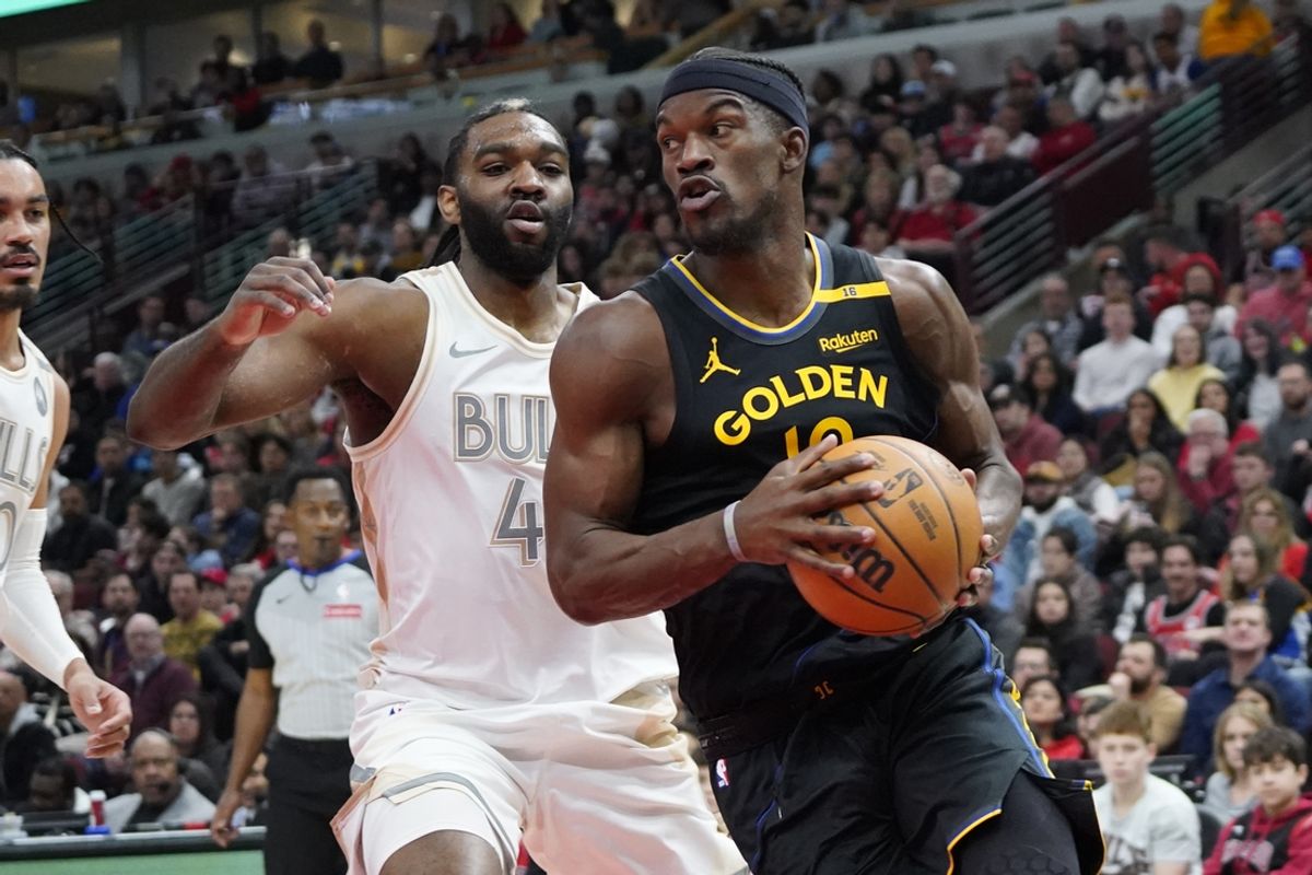 Feb 8, 2025; Chicago, Illinois, USA; Chicago Bulls forward Patrick Williams (44) defends Golden State Warriors forward Jimmy Butler (10) during the first half at United Center. Mandatory Credit: David Banks-Imagn Images